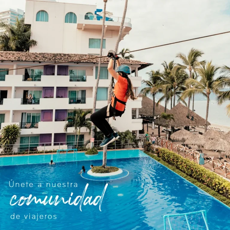 Person zip-lining over pool at tropical resort with beach view.